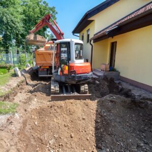 excavator by house